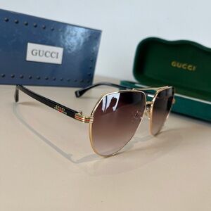 Gucci Gold Frame Sunglasses with Black Temples